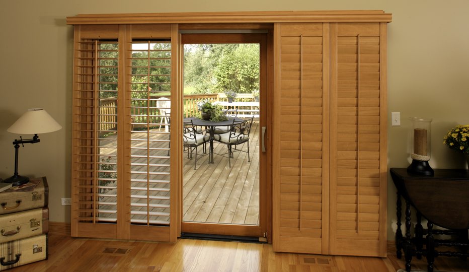 Wood bypass patio door shutters in Kingsport living room